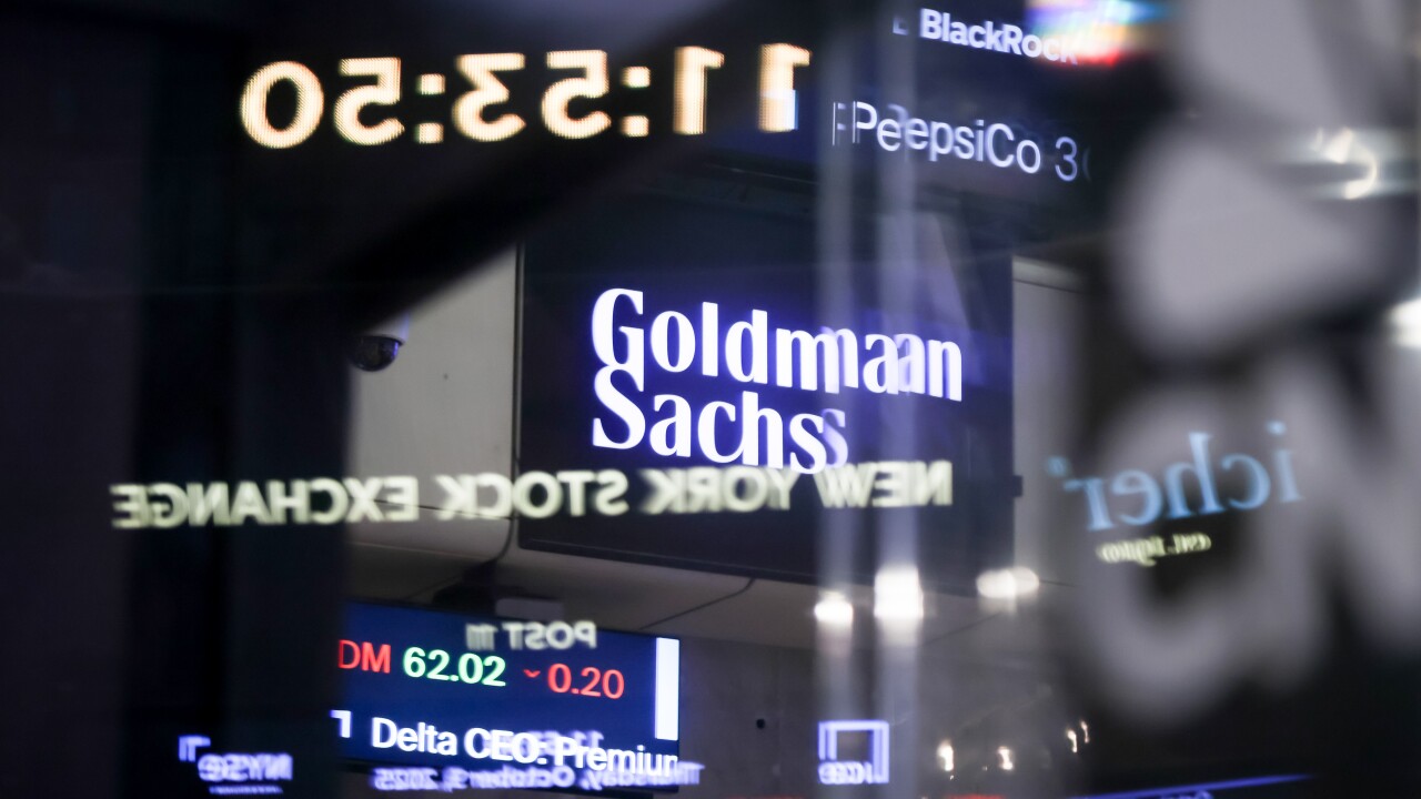 The logo of Goldman Sachs appeared on a screen at the New York Stock Exchange. The megabank reached an agreement last month with the National Legal and Policy Center, a conservative advocacy group, to remove diversity, equity and inclusion criteria from its board selection process.