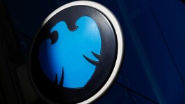 A logo for a Barclays bank branch sits on a sign in London.