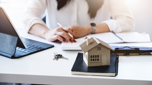 Entrepreneurs, business owners, accountants, real estate agents, focusing on tabletop home models with women using home equity budget calculators to assess their financial risks.