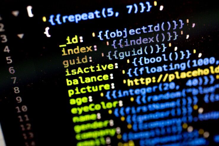 A sample of JSON (JavaScript Object Notation) computer code is displayed on a monitor for a photograph in Tiskilwa, Illinois, U.S., on Wednesday, July 12, 2017. JSON is a lightweight data-interchange format. Photographer: Daniel Acker/Bloomberg