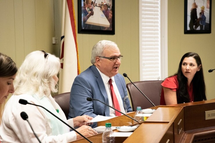 In South Carolina, Berkeley County School Superintendent Eddie Ingram, center, talks at the April 30 school board meeting.