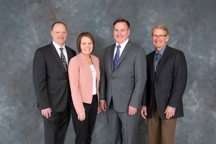 Veridian Credit Union's chief officers pictured at the credit union’s 2018 Annual Meeting. From left to right: Chief Financial Officer Keith Mesch, Chief Administration Officer Renee Christoffer, President and CEO Monte Berg and Chief Operations Officer Doug Gilbertson.
