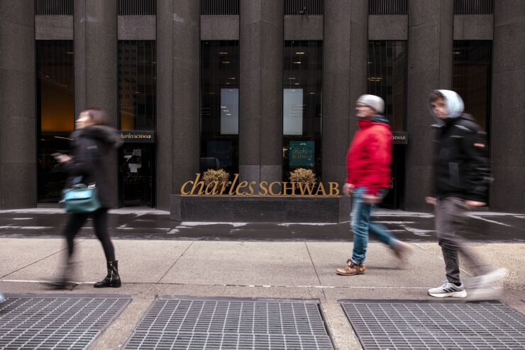 Charles Schwab exterior building with pedestrians