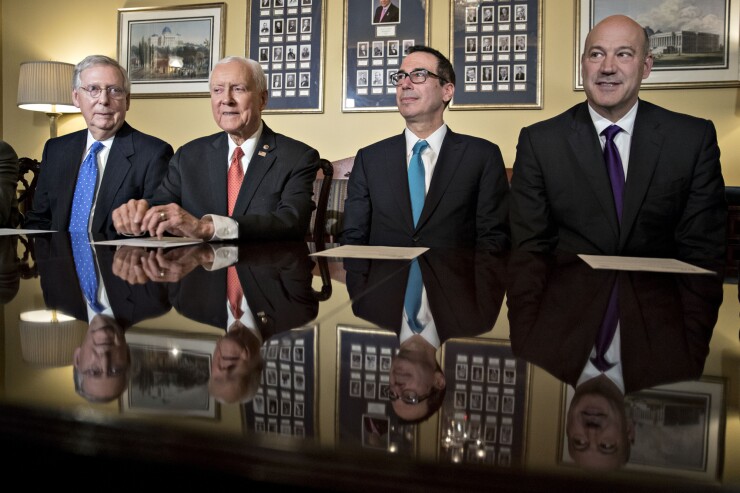 Senate Majority Leader Mitch McConnell, R-Ken., Senate Finance Committee chairman Orrin Hatch, R-Utah, Treasury Secretary Steven Mnuchin, and U.S. National Economic Council director Gary Cohn