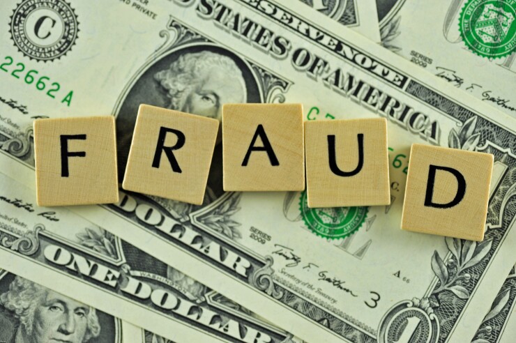 fraud-over-dollar-bills-36201847-adobe.jpeg