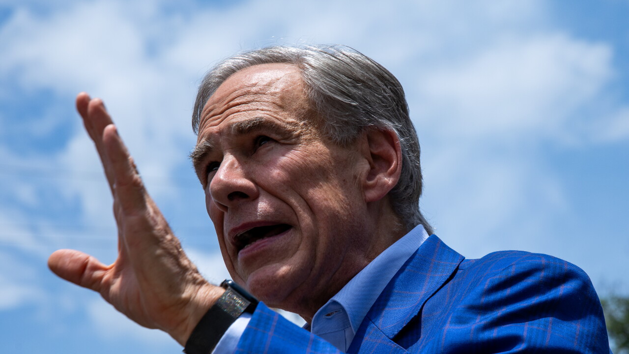 Abbott speaks to the media after casting ballot