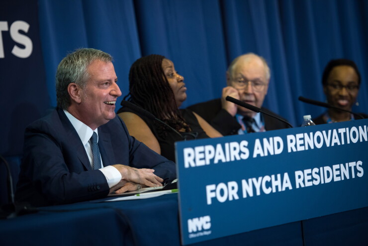 Mayor Bill de Blasio announces a commitment from the New York City Housing Authority to renovate nearly 2,400 apartments across 21 public housing developments in Brooklyn and Manhattan on Monday, June 25, 2018.