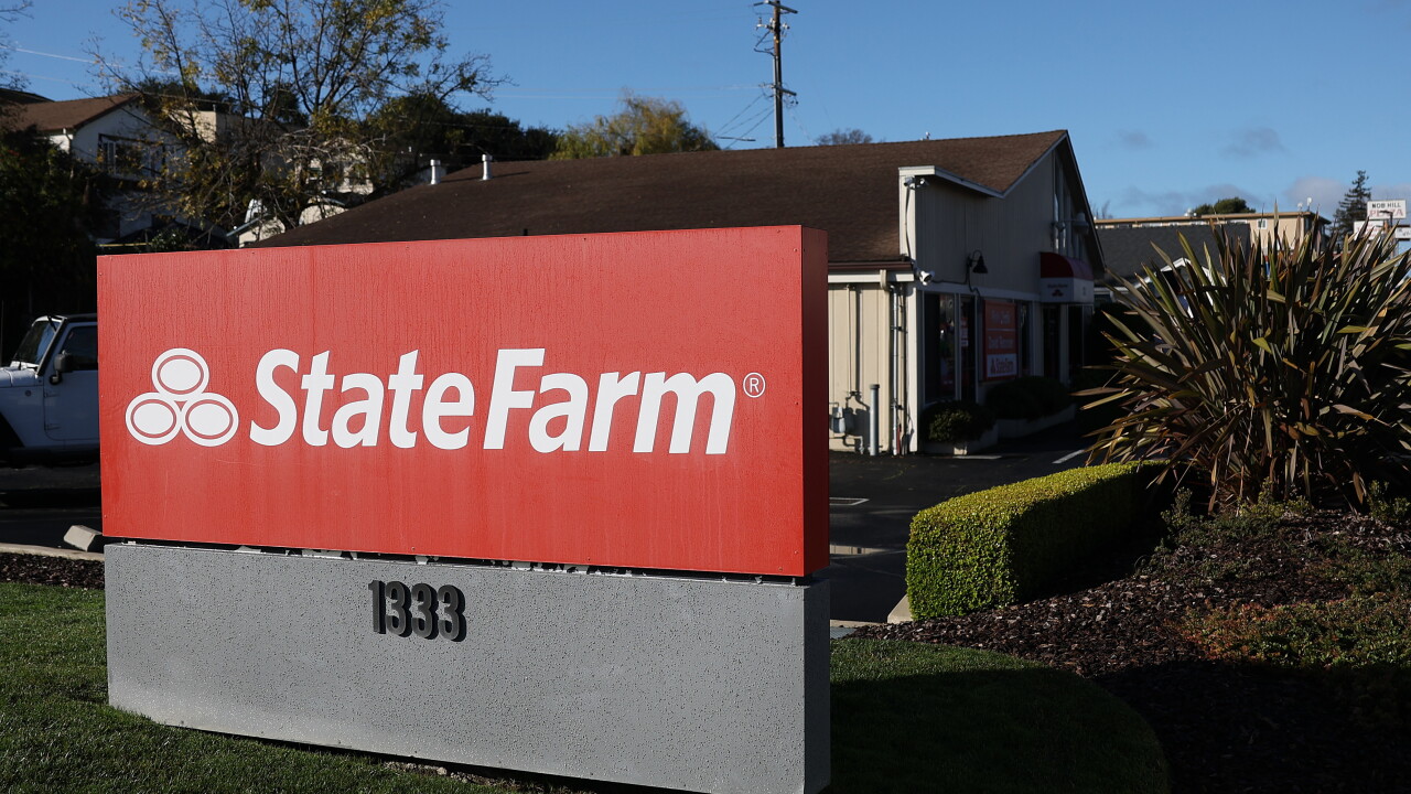 A sign in front of the State Farm insurance office in Pinole, California.