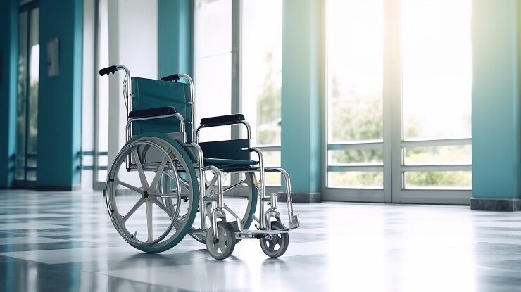 Empty wheelchair in hospital hallway
