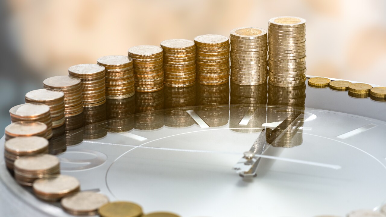 Gold coins compounding in size around a clock