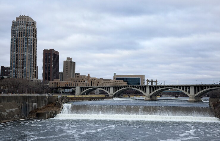 St. Anthony Falls cascades on the Mississippi River in Minneapolis, Minnesota, U.S., on Tuesday, Dec. 27, 2011.