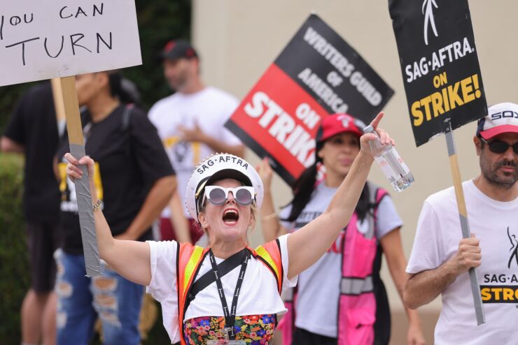 Writers Guild of America and Screen Actors Guild members and supporters on a picket line outside Paramount Studios in Los Angeles on Aug. 11, 2023.