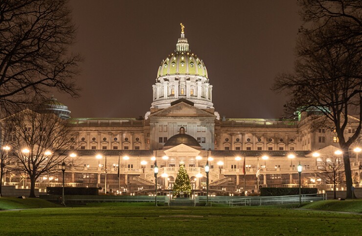 Harrisburg, Pennsylvania's state capital, at night. Fitch said its upgrade was also based on the state's "improved operating performance, as well as a low long-term liability burden and broad flexibility to manage spending pressures, which offset modest baseline revenue growth and a historically contentious decision-making environment."