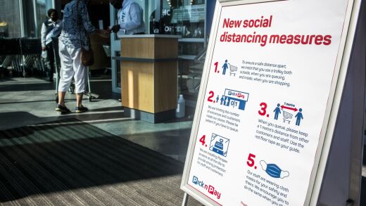 A sign advising of social distancing measures in place stands on display at the entrance to a Pick n Pay Stores Ltd. supermarket in Johannesburg, South Africa, on Monday, May 11, 2020.