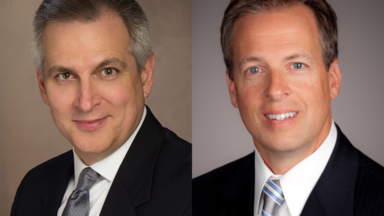 Jay Pelham (left), president of TotalBank in Miami, and Scott Goodman, president of Enterprise Financial in St. Louis.