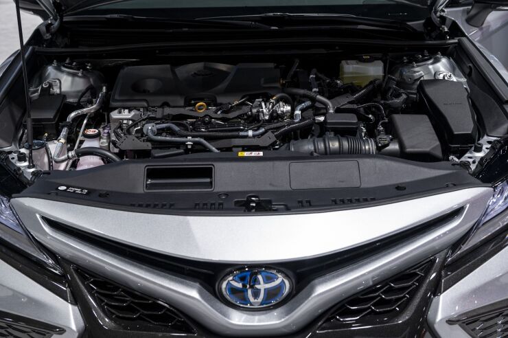 The engine of a 2021 Toyota Camry hybrid sedan during the Chicago Auto Show in Chicago on July 15, 2021. The Chicago Auto Show marks not only the resumption of the largest U.S. auto show, but also heralds the return of those crowded industry conventions, and the tourist and tax dollars they bring.
