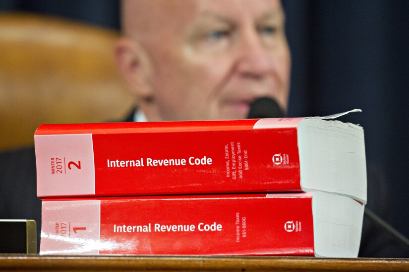 GOP tax plan with Rep. Kevin Brady in background