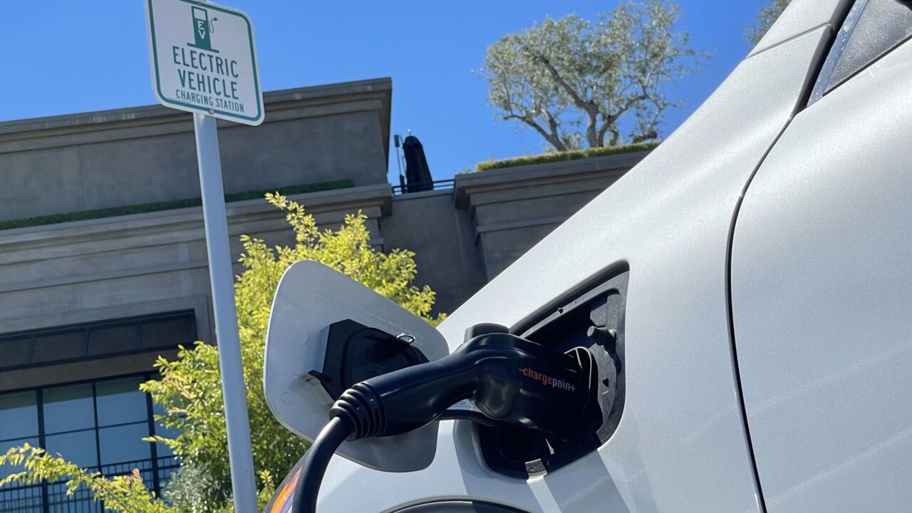 Photo of an electric car charging at a mall parking lot in California.
