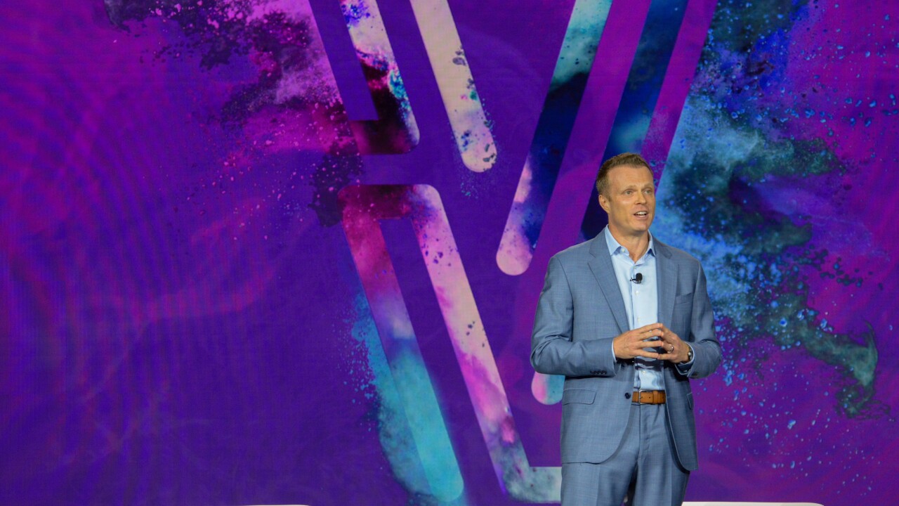 Scott Brown, group president of financial and marketing services for Experian North America, speaks at Experian Vision 2025 conference.