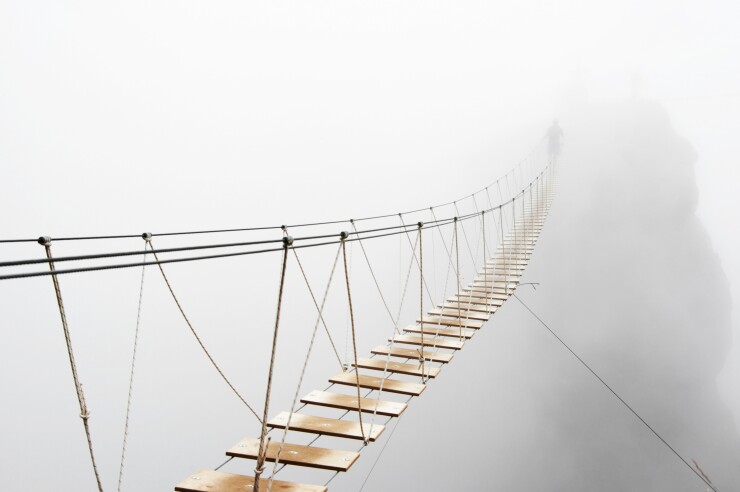 Hanging bridge in fog