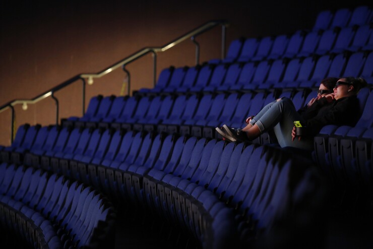 Audience members watch a movie at the Tennessee Aquarium IMAX Corp. movie theater in Chattanooga, Tennessee.