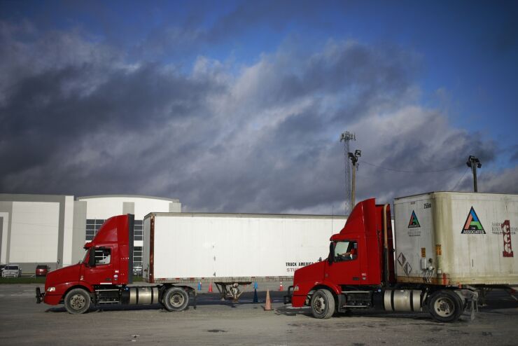 Students drive semi trucks while practicing for their commercial driver's license (CDL) test at Truck America Training of Kentucky in Shepherdsville, Kentucky, U.S., on Monday, Oct. 25, 2021. The nation's trucking shortage already stands at a record 80,000 drivers and that’s set to surpass 160,000 in 2030, the association said in a report dated Monday. The group based its estimates on retirements and a pandemic-fueled exodus from the industry, among other things. Photographer: Luke Sharrett/Bloomberg