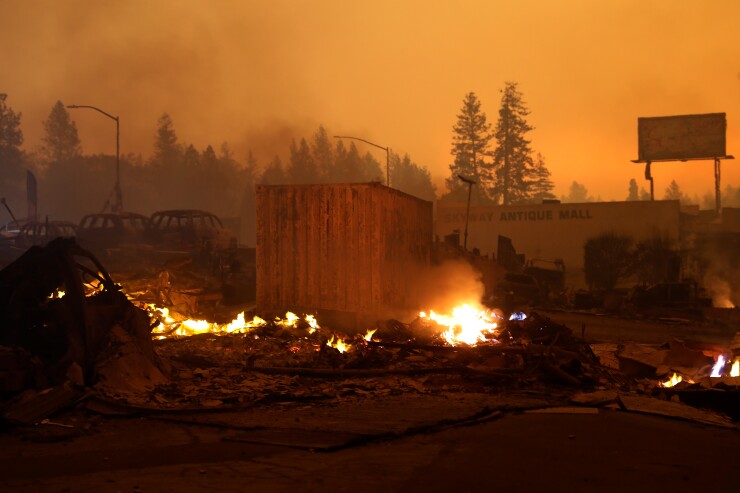 The wreckage of burned buildings continue to smolder during the Camp Fire in Paradise, California, U.S., November 9, 2018