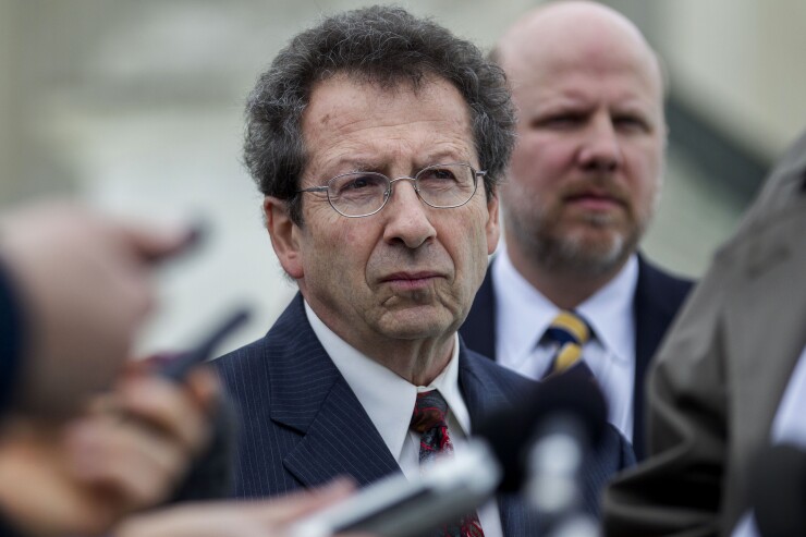 Sam Kazman, general counsel with the Competitive Enterprise Institute, listens during a news conference in front of the U.S. Supreme Court in Washington, D.C. on Wednesday, March 4, 2015.