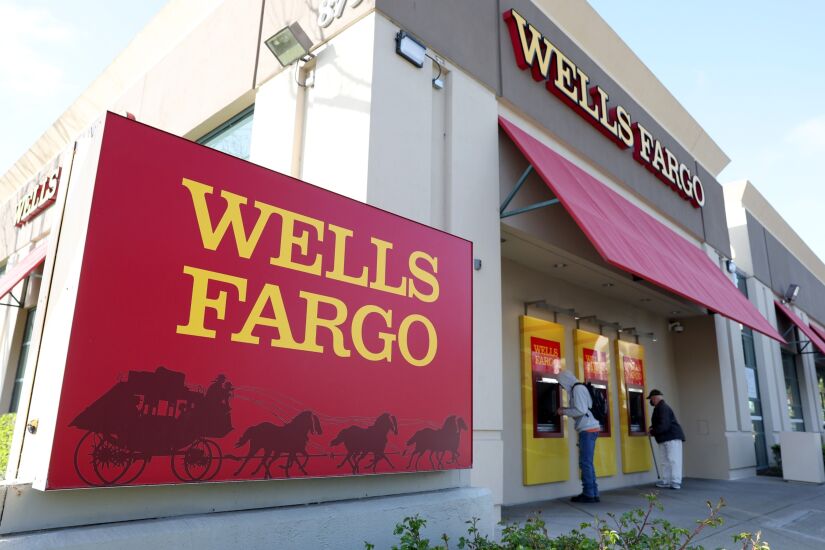 Wells Fargo cuts about 50 investment bankers as deals slump