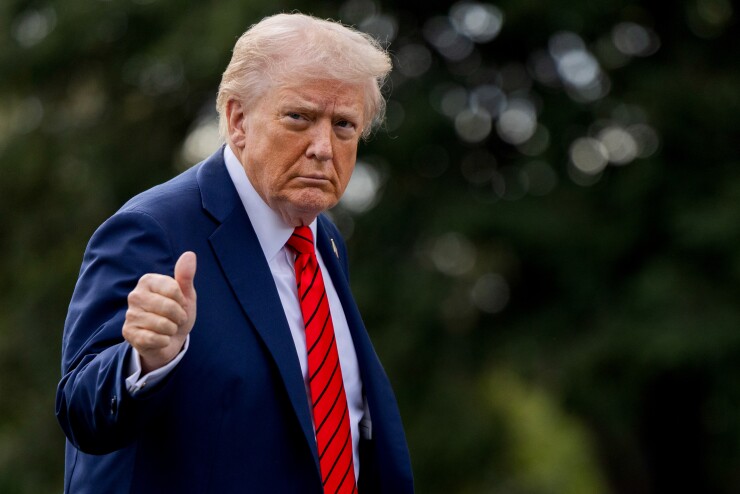 President Donald Trump walks on the South Lawn of the White House.