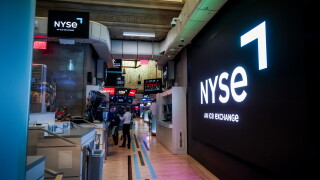 Traders work on the floor at the New York Stock Exchange.