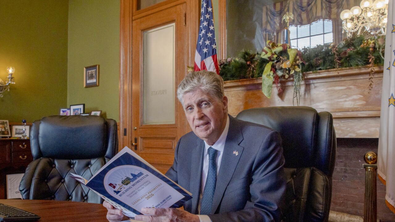 Rhode Island Governor Dan McKee sits at his desk in the State House in Providence, Rhode Island.