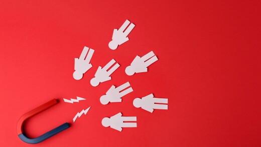 Magnet and paper people on red background, flat lay