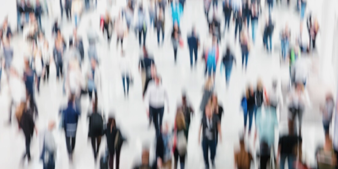 Crowd of anonymous, blurred people.