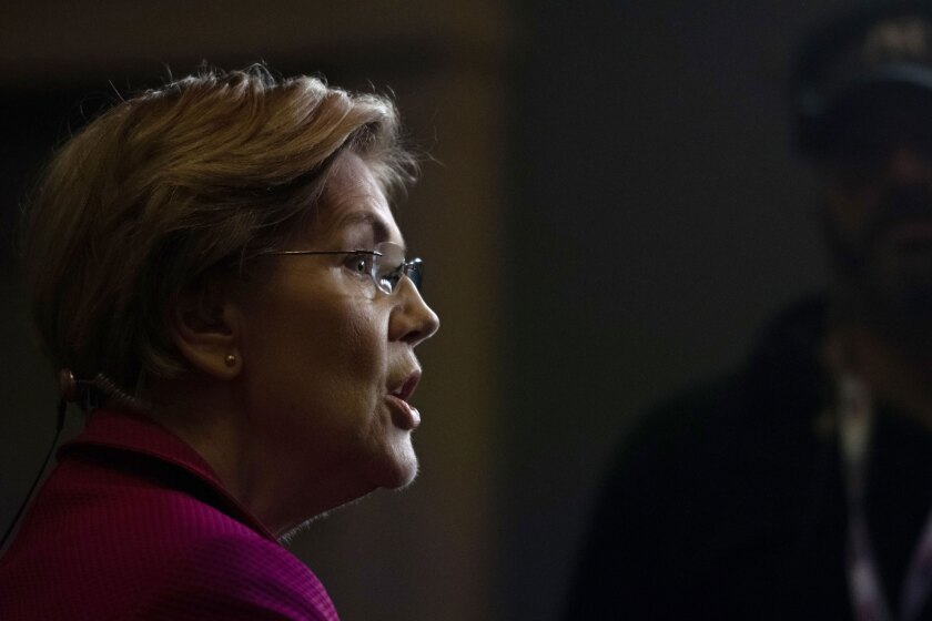 Sen. Elizabeth Warren, D-Mass. and 2020 presidential candidate, speaks to a member of the media following the Democratic presidential candidate debate in Charleston, South Carolina, on Feb. 25, 2020.