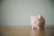 Piggy bank on wood table. Financial investment and save money concept