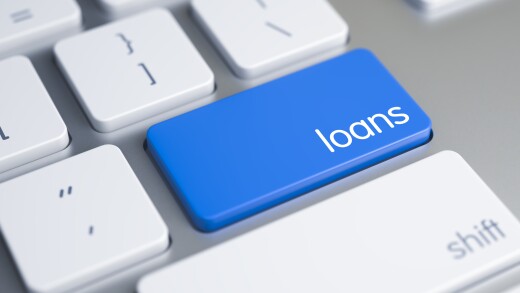 Online lending image. Keyboard with big key that says "loans"