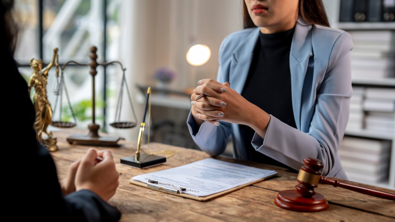 Lawyer discussing contract with client about legal case and litigation concept