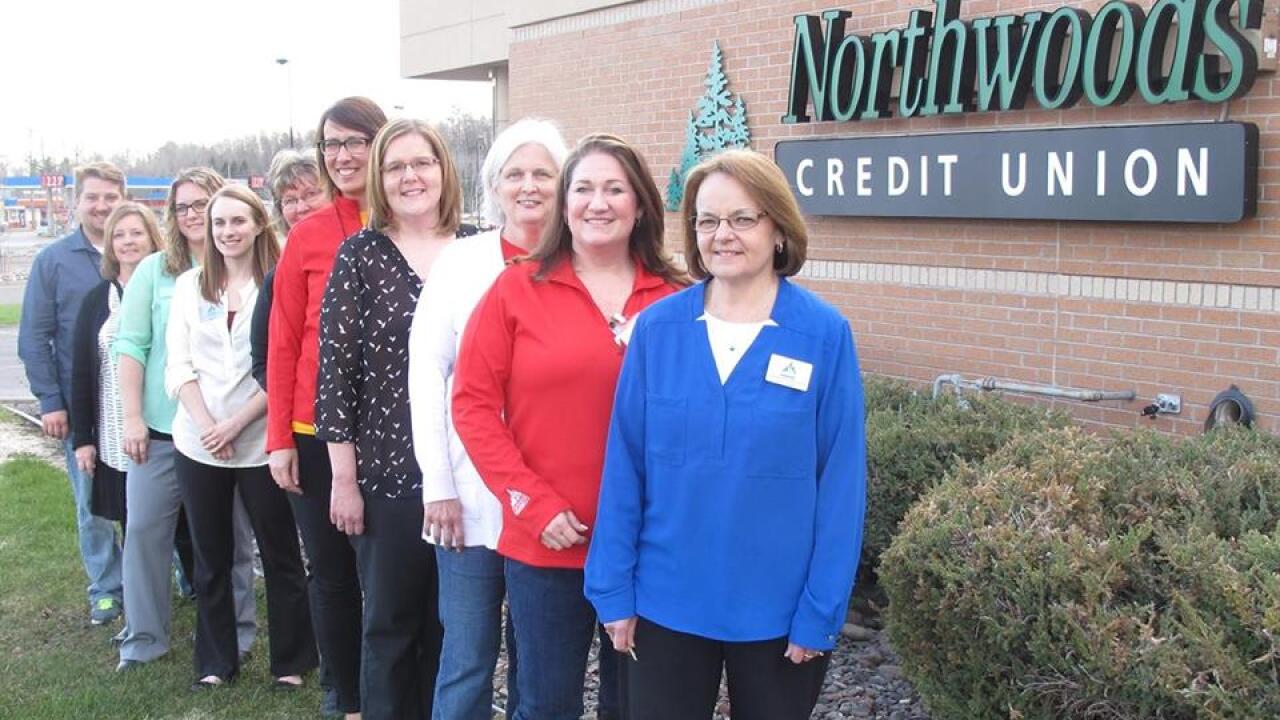 Barb Brown, Northwoods Credit Union president and CEO, at far right, with other Northwoods employees