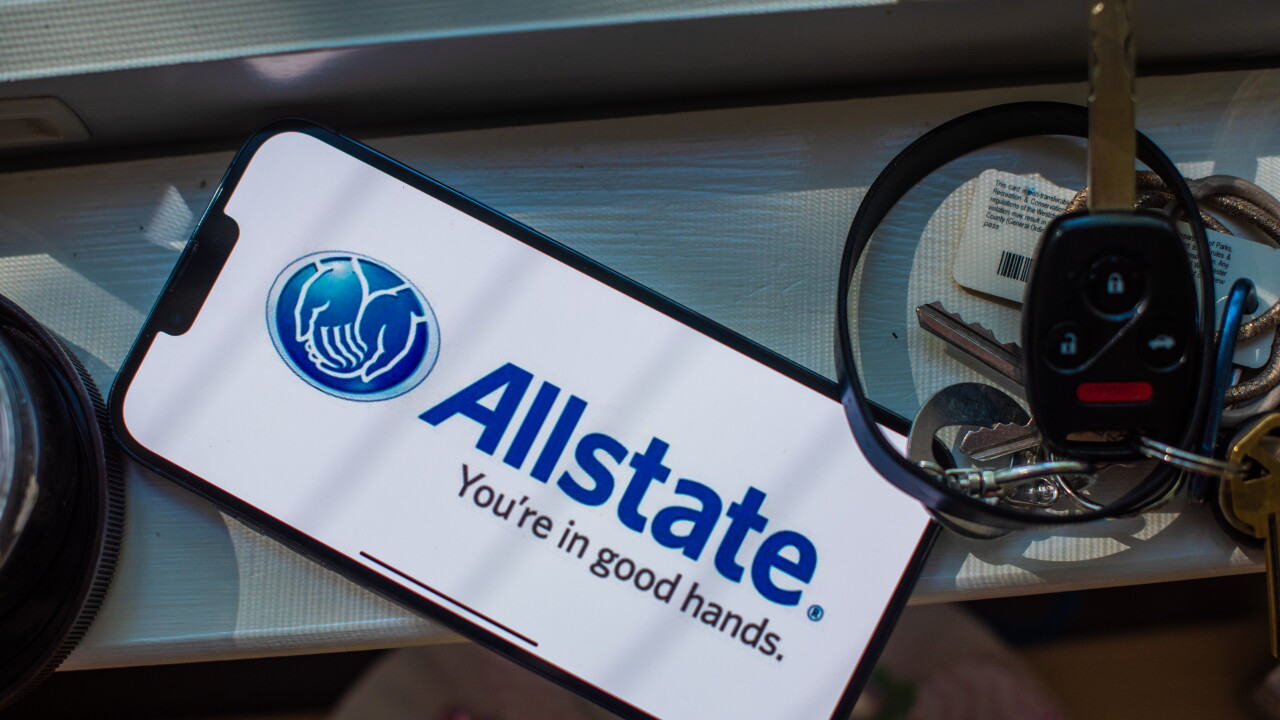Allstate logo on a phone screen next to keys.