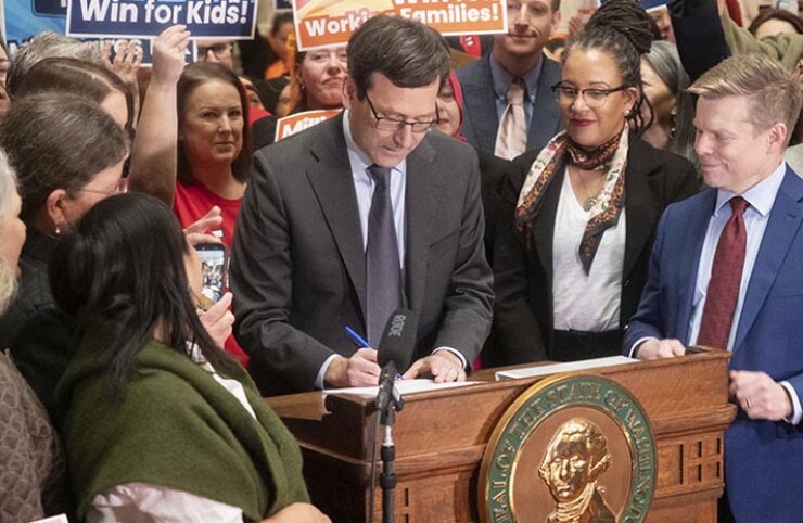 Washington Gov. Bob Ferguson signs millionaires tax.