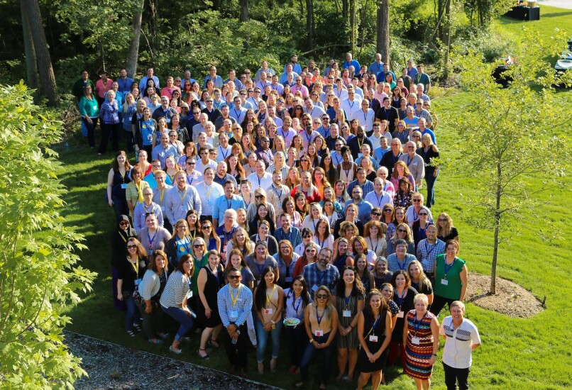 During a picnic in 2018, Consumers CU’s 300 employees, including senior management, gather for a photo celebrating the credit union surpassing the $1 billion-asset mark.