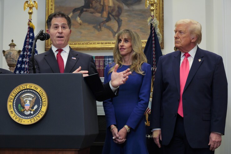 (L-R) Tech billionaire Michael Dell speaks as his wife Susan Dell and President Donald Trump look on while making an announcement about "Trump accounts" in the Roosevelt Room at the White House.