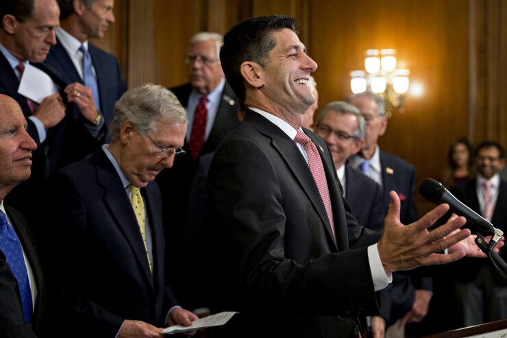U.S. House Speaker Paul Ryan, a Republican from Wisconsin, laughs while speaking during a news conference on a unified tax reform framework at the U.S. Capitol in Washington, D.C., Sept. 27, 2017 Bloomberg News