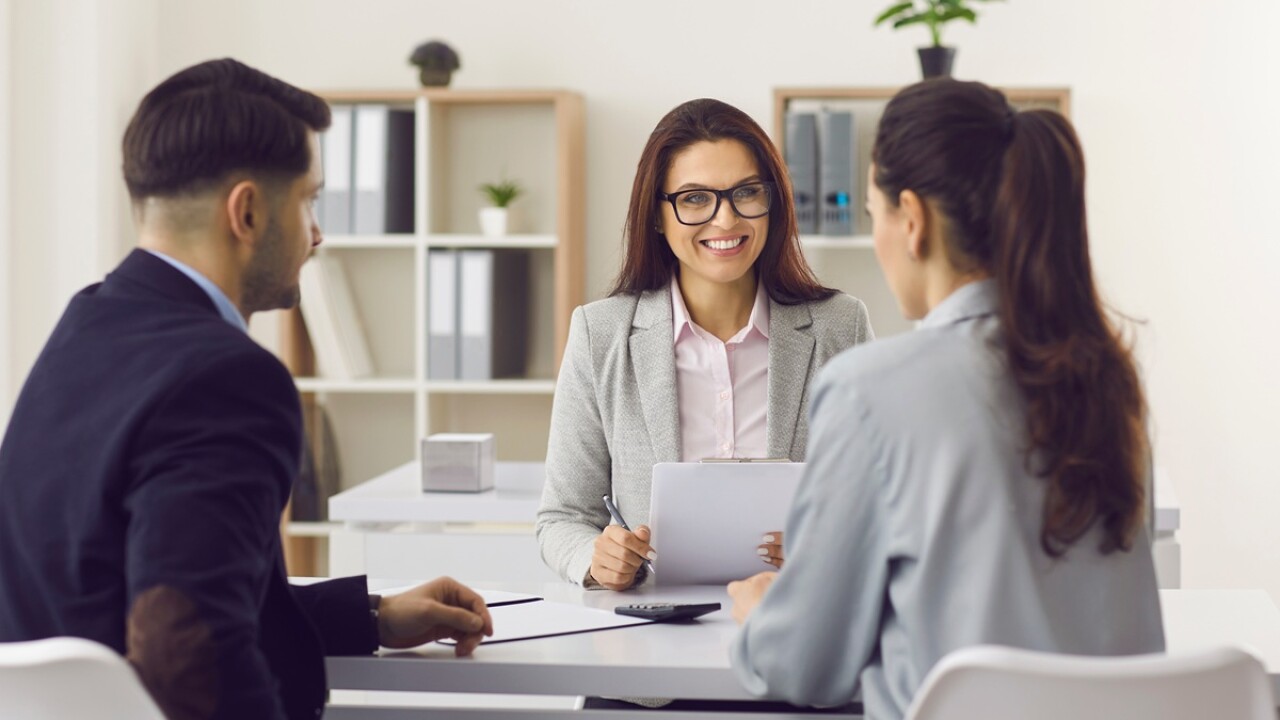 Insurance broker meeting with clients.