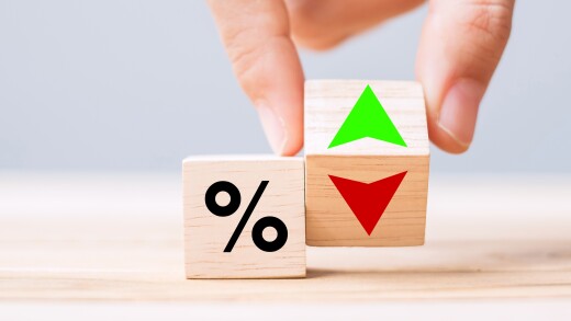 business man Hand change wood cube block with percentage to UP and Down arrow symbol icon. Interest rate, stocks, financial, ranking, mortgage rates and Cut loss concept