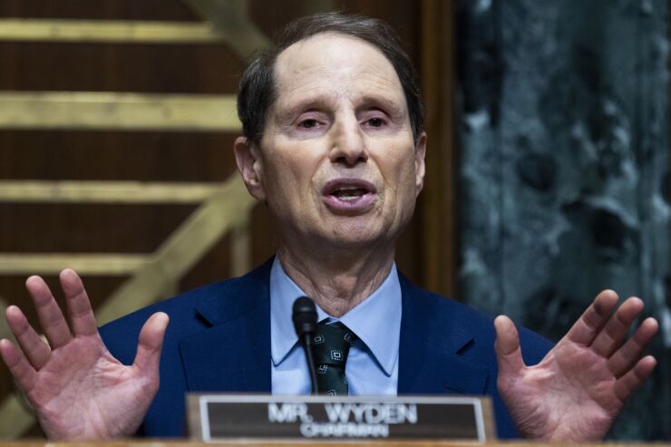 Sen. Ron Wyden, an Oregon Democrat, wants the tax benefit to go to more professionals but not to wealthy business owners.