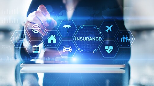 A person interacting with a holographic image that reads insurance with other icons around it.