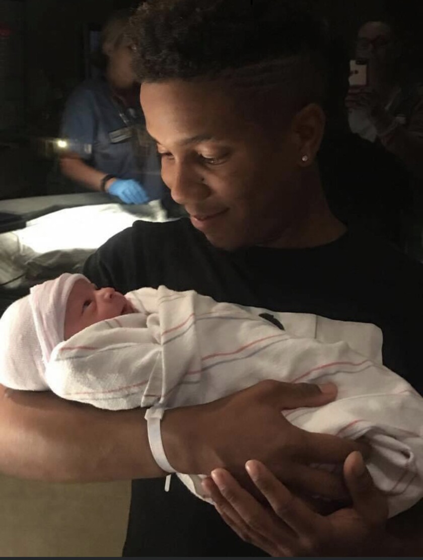 Jonathan Erick Alexander, advisor Rachel Robasciotti's then 26-year-old cousin, with his newborn son and namesake a couple of months before he died in 2018.