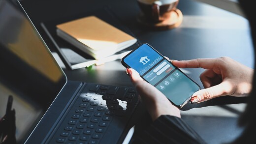 Cropped shot of executive woman holding smartphone in hands whil
